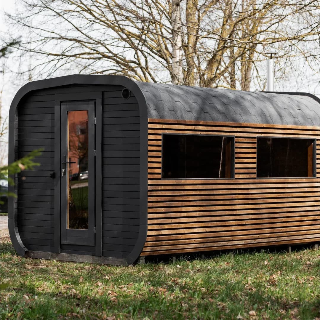 Outdoor cube sauna with changing room